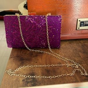 Plum color clutch with golden chain